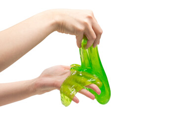 Green slime toy in woman hand isolated on white.