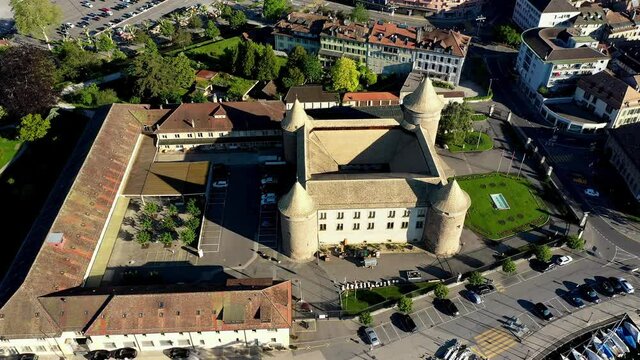 Aerial flying above Morges Castle along the lakefront of Lake Geneva