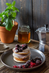 Pancakes with blackberries, raspberries and red currants. American cuisine.