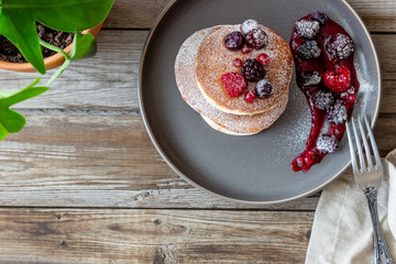 Pancakes with blackberries, raspberries and red currants. American cuisine.