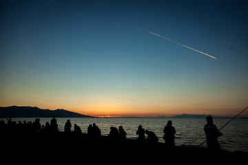 a vibrant blue and golden sunset in the swirling clouds of the izmir-Turkiye