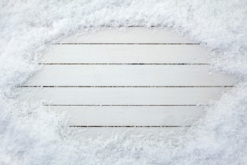 Old wooden board with snow flakes. Christmas background with copy space