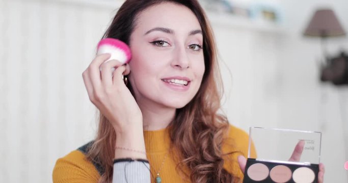 Influencer recording make up tutorial video at home