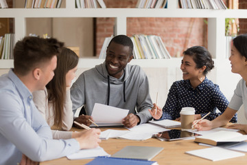 Group of diverse students enjoying study time together.