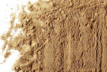 Ginger powder isolated on white background, top view, Zingiber officinale