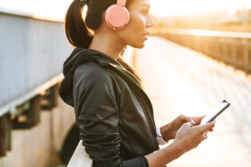 Concentrated woman using mobile phone.