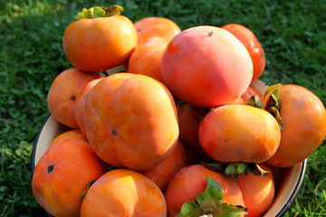 Ripe persimmons in a bowl