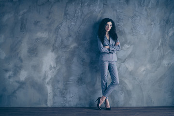 Obraz na płótnie Canvas Full length body size view of her she nice attractive lovely charming classy chic content wavy-haired girl hr executive director company leader folded arms gray concrete wall background