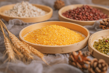 Chinese traditional grains in chinese steamer on wooden table. Made of maize, mung bean, chinese red bean. Chinese traditional food concept