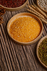 Chinese traditional grains in chinese steamer on wooden table. Made of maize, mung bean, chinese red bean. Chinese traditional food concept