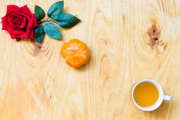 Fresh banana and persimmon in brick wall background and wooden table,
