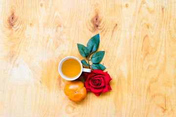 Fresh banana and persimmon in brick wall background and wooden table,