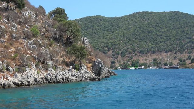 Tersane Bay, Fethiye, Turkey - 30th of July 2019: 4K Entering Tersane bay on the boat trip