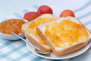 Tasty sandwich with apricot jam.