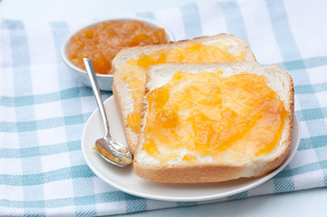 Tasty sandwich with apricot jam.