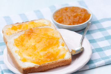 Tasty sandwich with apricot jam.