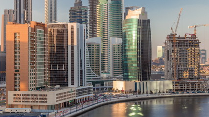 Fototapeta na wymiar Skyscrapers at sunny day in Dubai with blue sky aerial timelapse