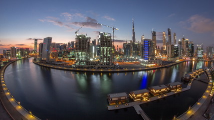 Fototapeta premium Dubai city center at sunset near river aerial timelapse