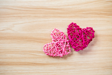Pink heart on wooden table background, design wooden heart with space on wood background, valentine concept