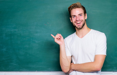 Giving our best. back to school. empty blackboard information. man teacher at school lesson....