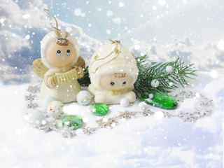 Two Christmas Angels and snowfall. Merry Christmas and Happy New Year.