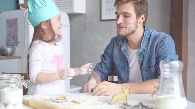 family activities: dad teach daughter to cook bakery. weekend hobby family love concept