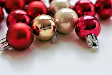 Some christmas tree balls in red and beige. Merry Christmas decor concept.