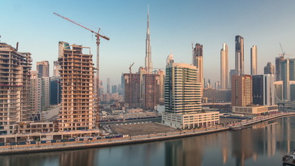 Fototapeta na wymiar The rhythm of the city of Dubai from night to morning aerial timelapse