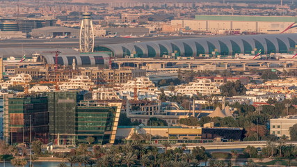 Fototapeta na wymiar View of modern buildings in luxury Dubai city at sunset aerial timelapse
