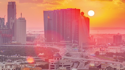 View of modern buildings in luxury Dubai city at sunset aerial timelapse