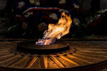 The flame of the unknown soldier under the Arc de Triomphe in Paris, France