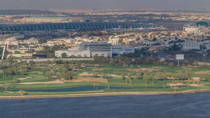 View of park near canal and buildings in luxury Dubai city, United Arab Emirates Timelapse Aerial