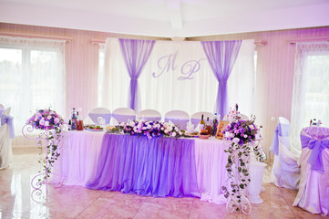 Beautiful wedding purple set decoration in the restaurant.