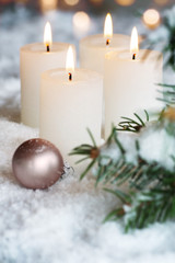 Advent candles in snow