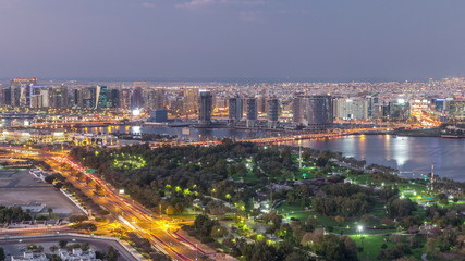 Fototapeta na wymiar View of lights from illuminated roads and windows in luxury Dubai city, United Arab Emirates Timelapse Aerial