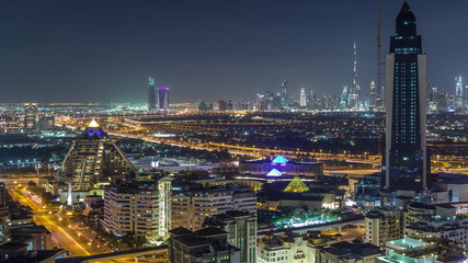 Aerial view of the rhythm illuminated city with lights of Dubai aerial timelapse