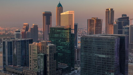 Fototapeta na wymiar Dubai's business bay towers at morning aerial timelapse.