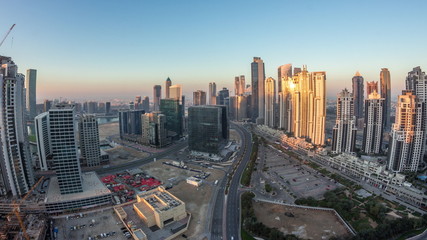 Panorama of Business bay Dubai night to day aerial timelapse.