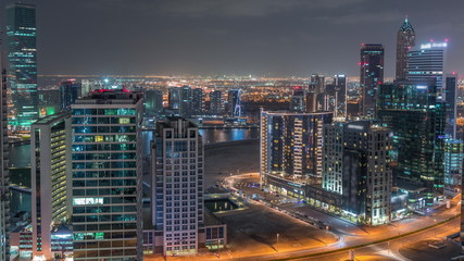 Dubai's business bay towers aerial night timelapse.