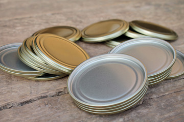  Metal lids for rolling cans during canning.