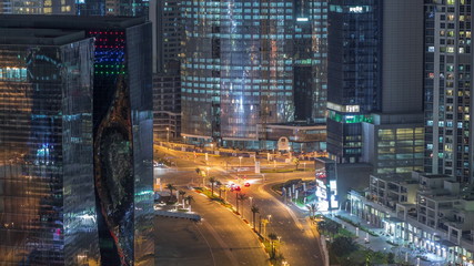 Top view city traffic on a crossroad in Dubai Business bay night timelapse.