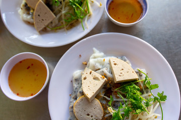 Vietnamese dish of rice paper filled with meat and mushrooms, and sliced luncheon meat