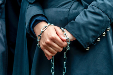 Chained woman's hands in Ashura ceremony. Ashura (asura or asure) ceremony in istanbul. These Shiite woman mourn for Husayn who killed in Battle of Karbala. 