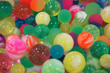 Fototapeta na wymiar Rubber colorful shining toy ball