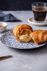 Breakfast with croissant and black coffee