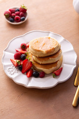 Trendy homemade japanese pancakes for breakfast with berries 