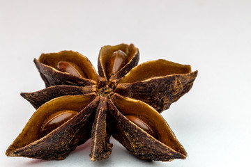 close up image of a star anise isolated on white background