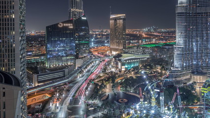 Obraz premium Panoramic skyline view of Dubai downtown with mall, fountains and skyscrapers aerial night timelapse