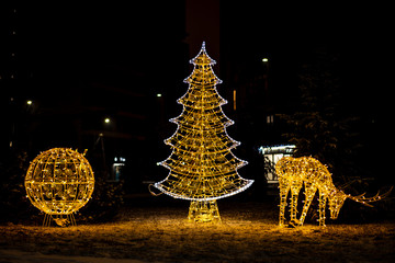 beautiful christmas glowing figures on a city street