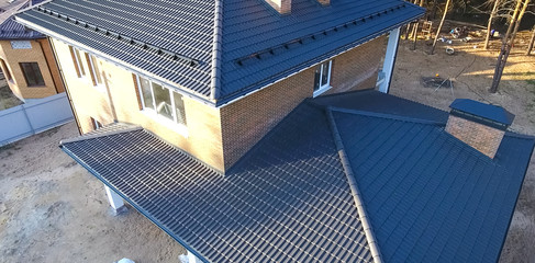 House with ceramic tile roof. cement-sand roof tiles.